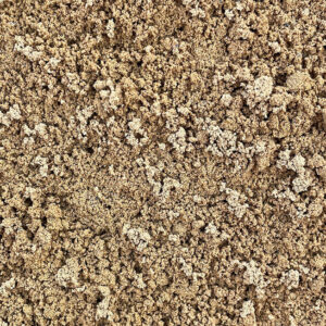 Close-up of building sand from Runfold, Farnham, Surrey; loose light brown grains with small clumps and scattered granules.